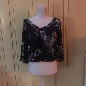 navy blue blouse with feather design